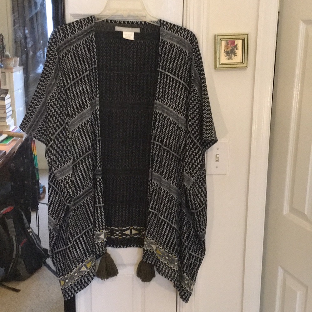Boho chic open poncho with embroidery and tassels